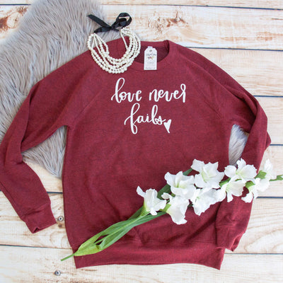 Love Never Fails Premium Fleece Pullover